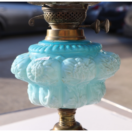 151 - Two Victorian oil lamps; together with a copper oil lamp on a mahogany stand (all a/f) (3).