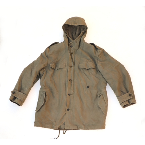 97 - A quantity of assorted military uniform to include winter jackets and other similar items.