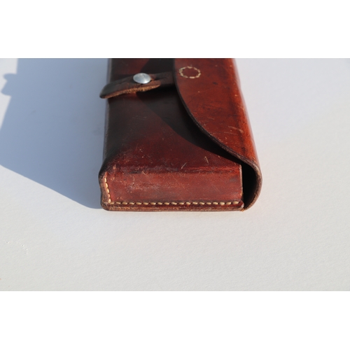 77 - Swiss Army leather ammunition pouch or cartridge case 22.5cms (8.875ins) wide, stamped to the revers... 