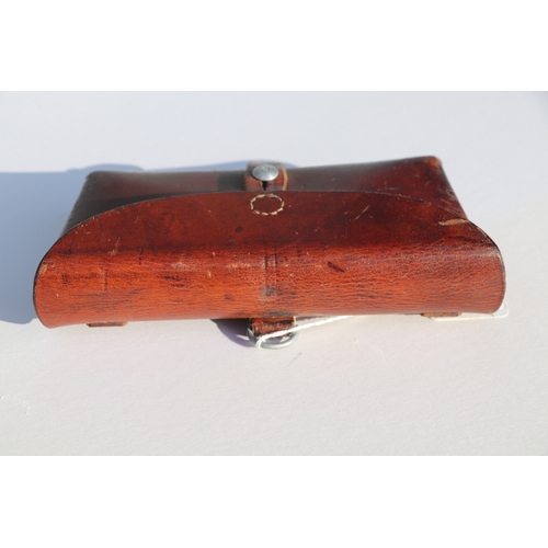 77 - Swiss Army leather ammunition pouch or cartridge case 22.5cms (8.875ins) wide, stamped to the revers... 