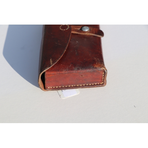 77 - Swiss Army leather ammunition pouch or cartridge case 22.5cms (8.875ins) wide, stamped to the revers... 