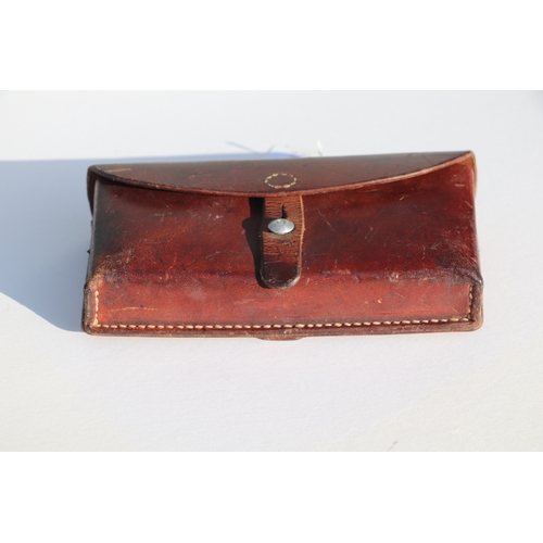 77 - Swiss Army leather ammunition pouch or cartridge case 22.5cms (8.875ins) wide, stamped to the revers... 