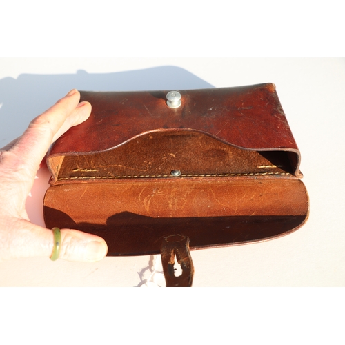 77 - Swiss Army leather ammunition pouch or cartridge case 22.5cms (8.875ins) wide, stamped to the revers... 