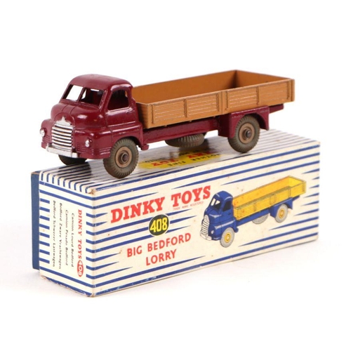 132 - A Dinky Toys no. 408 big Bedford lorry, maroon cab with light tan flatbed and cream hubs, boxed.Cond... 