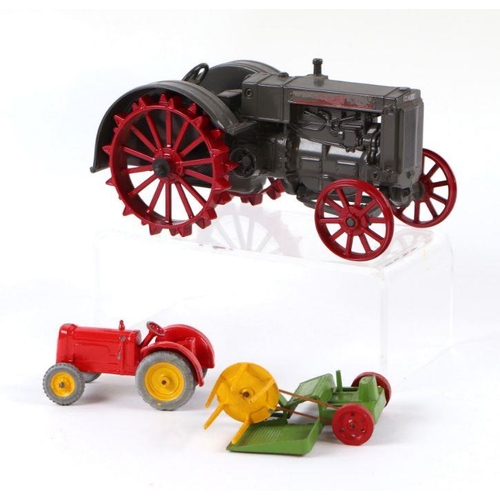 142 - A Charbens Farm Series Tractor & Reaper Set, boxed; together with an ERTL CASE L Tractor (2).