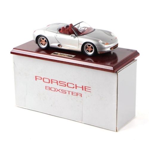 193 - A Porsche Boxter 180/18 scale metal diecast model mounted on a plinth, boxed.