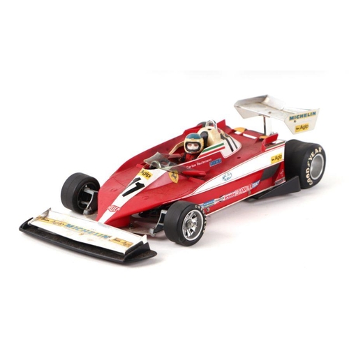 208 - A Tamiya 1/12 scale radio controlled Ferrari F1 Grand Prix car; together with an Acoms AP-227 Mk 2 r... 