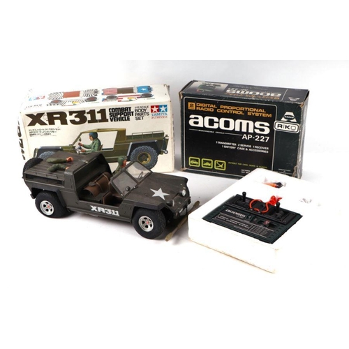 209 - A Tamiya 1/12 scale XR311 remote control combat support vehicle; together with an Acoms AB 2771 radi... 