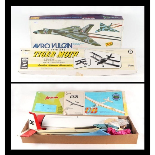 220 - A Micro-Mold Avoncraft Cub Glider, boxed, a Keil Kraft De Havilland Tiger Moth kit and an Avro Vulca... 