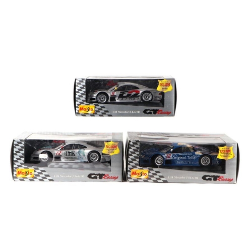 228 - Three Maisto 1/18 scale GT Racing diecast cars comprising Mercedes CLK-GTR, another similar and a Me... 