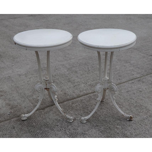 26 - A pair of Coalbrookdale style painted cast iron side tables, each with circular wooden tops, 45cms d... 