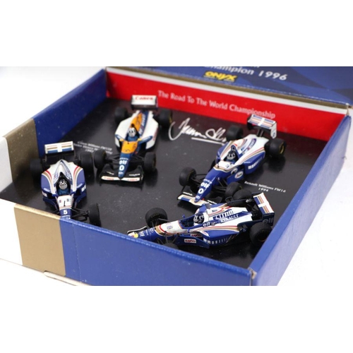 264 - An Onyx 1/43 scale Damon Hill Word Champion 1996 commemorative limited edition set incorporating Can... 