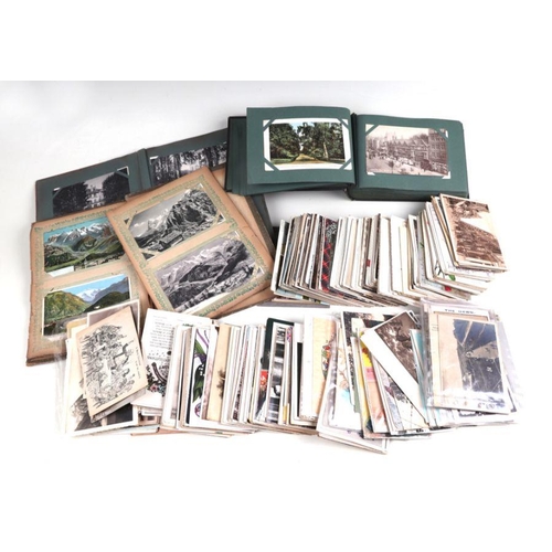 33 - A quantity of postcards, part albums and loose.