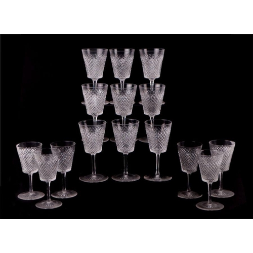 427 - An extensive suite of cut glassware to include wine glasses, sherry glasses, tumblers and finger bow... 