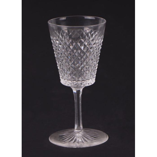 427 - An extensive suite of cut glassware to include wine glasses, sherry glasses, tumblers and finger bow... 