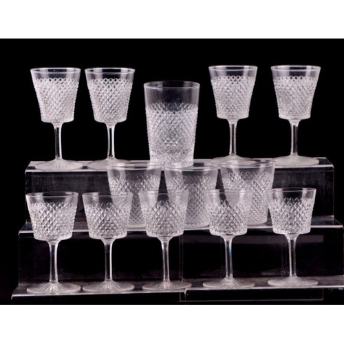 427 - An extensive suite of cut glassware to include wine glasses, sherry glasses, tumblers and finger bow... 