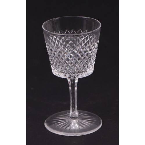 427 - An extensive suite of cut glassware to include wine glasses, sherry glasses, tumblers and finger bow... 