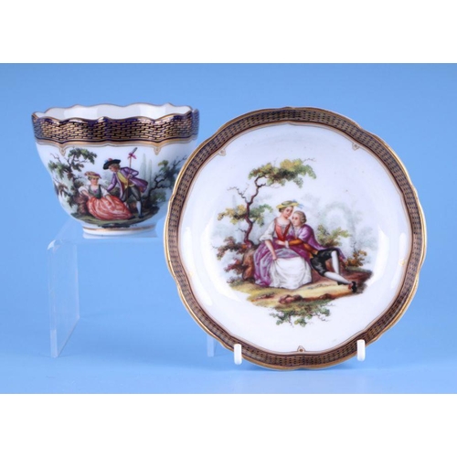 459 - A Meissen cabinet cup and saucer decorated with 18th century figures.