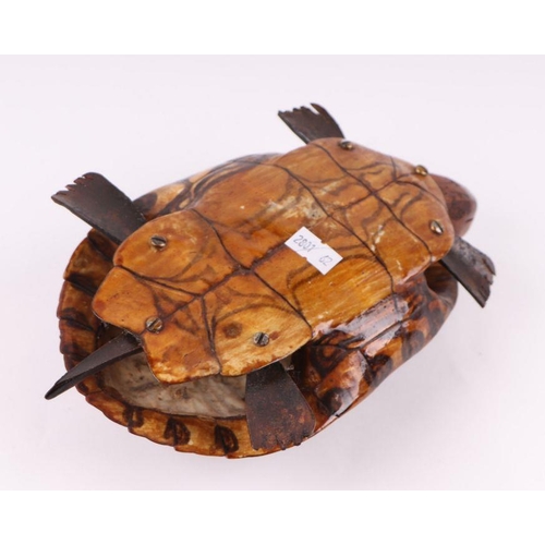 476 - Taxidermy.  A tortoise carapace with carved wooden head and feet, 20cms long.