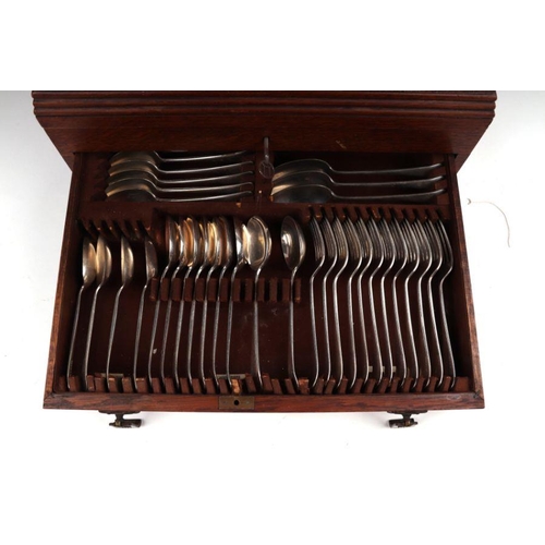 549 - An oak canteen containing Old English Pattern silver plated cutlery, 45cms diameter.