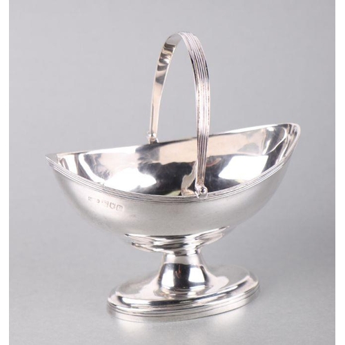 557 - An Edward VI silver swing-handled sugar bowl or bonbon dish of navette form, London 1910, 120g.