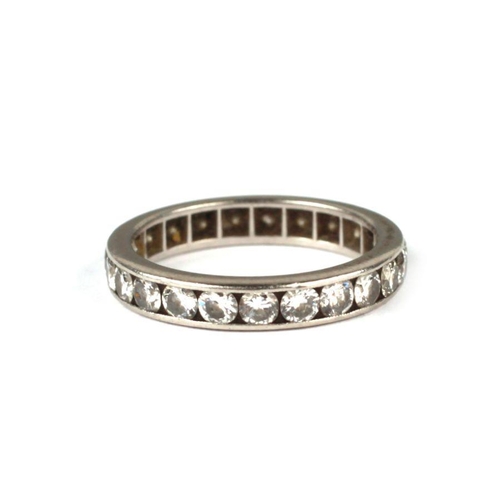 625 - A white metal diamond eternity ring, approx UK size 'I', 3.1g.