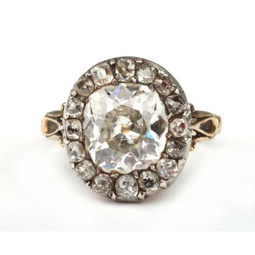 658 - A yellow metal mounted diamond ring with central old cut diamond surrounded by fifteen smaller diamo... 