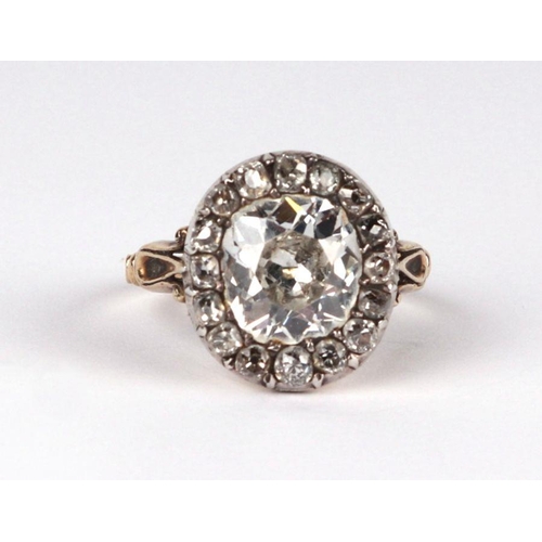 658 - A yellow metal mounted diamond ring with central old cut diamond surrounded by fifteen smaller diamo... 