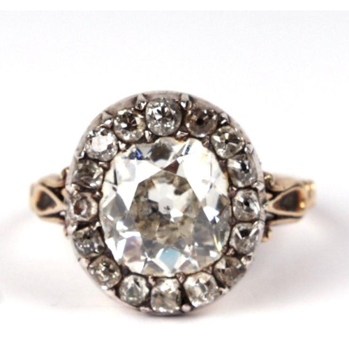 658 - A yellow metal mounted diamond ring with central old cut diamond surrounded by fifteen smaller diamo... 