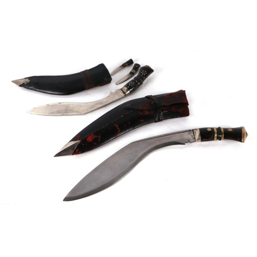 66 - A kukri with horn handle and leather scabbard, 42cms long; together with another similar, 4cms long ... 