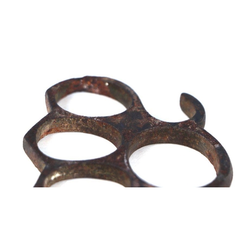 67 - A steel knuckle duster, 10cms wide.