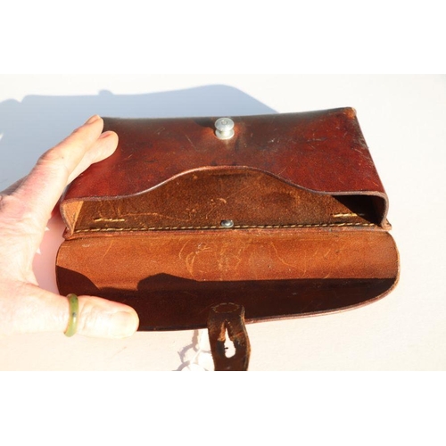 73 - Swiss Army leather ammunition pouch or cartridge case 22.5cms (8.875ins) wide, stamped to the revers... 