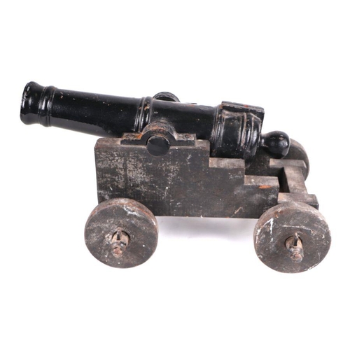 79 - A late 19th century signalling cannon. Having a cast iron barrel 49cms (19.25ins) long with an appro... 