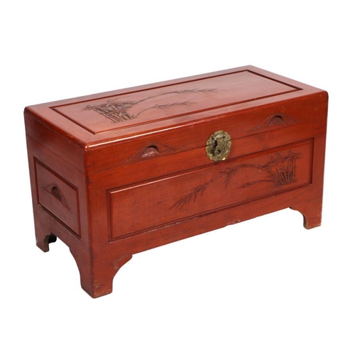 992 - A carved camphor wood chest, 102cms wide; together with a similar circular folding occasional table,... 