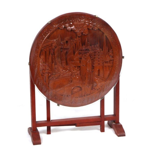 992 - A carved camphor wood chest, 102cms wide; together with a similar circular folding occasional table,... 