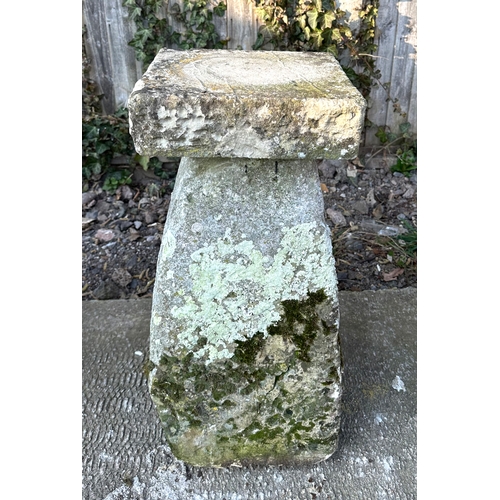 19 - A staddle stone with associated square top, 67cms high.