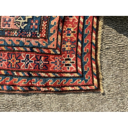 271 - A West Turkmenistan Tekke rug with a field of aina kochak guls, 164 by 244cms.