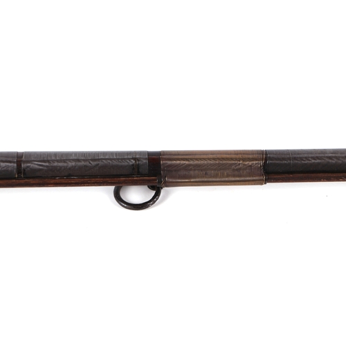 103 - A 19th century North African flintlock long gun, the lock and barrel signed and the stock with inlai... 