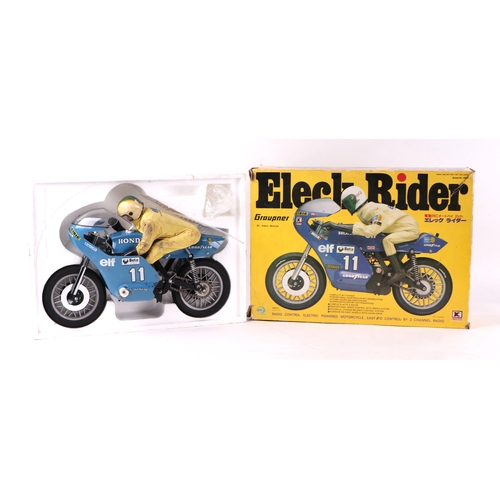 215A - A Grauper Eleck rider 1/18 scale radio and battery single seat racing bike with radio control both b... 