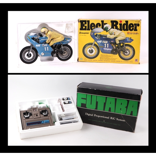 215A - A Grauper Eleck rider 1/18 scale radio and battery single seat racing bike with radio control both b... 