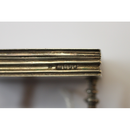 589 - An Edwardian miniature silver & enamel box modelled as an occasional table on turned supports joined... 