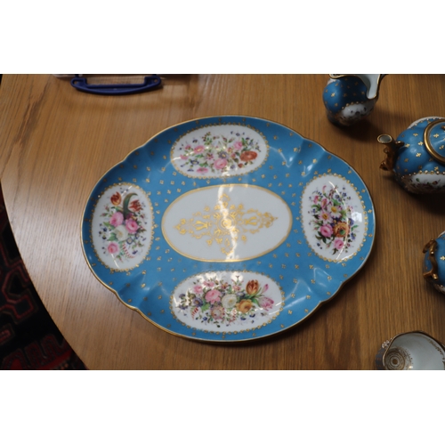 458 - A 19th century Sevres style Cabaret set decorated with flowers and gilt highlights, on a turquoise g... 