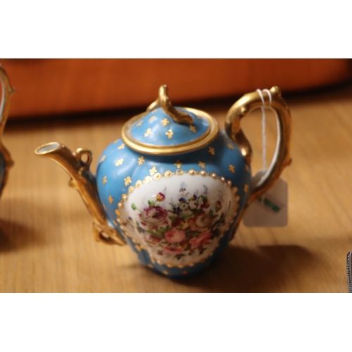 458 - A 19th century Sevres style Cabaret set decorated with flowers and gilt highlights, on a turquoise g... 