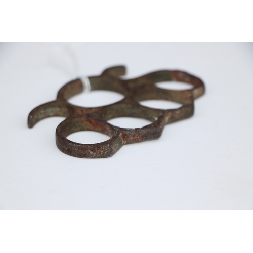 67 - A steel knuckle duster, 10cms wide.