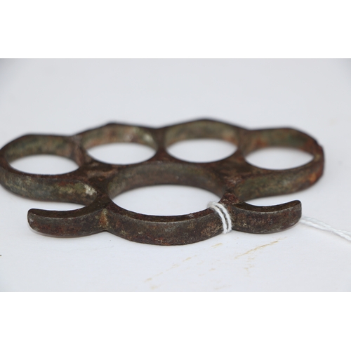 67 - A steel knuckle duster, 10cms wide.