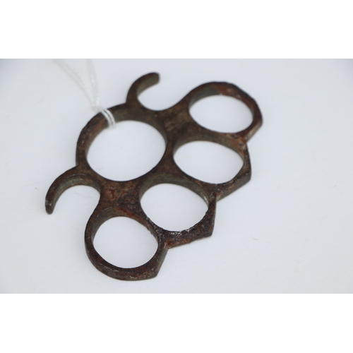 67 - A steel knuckle duster, 10cms wide.