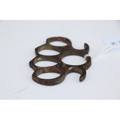 67 - A steel knuckle duster, 10cms wide.