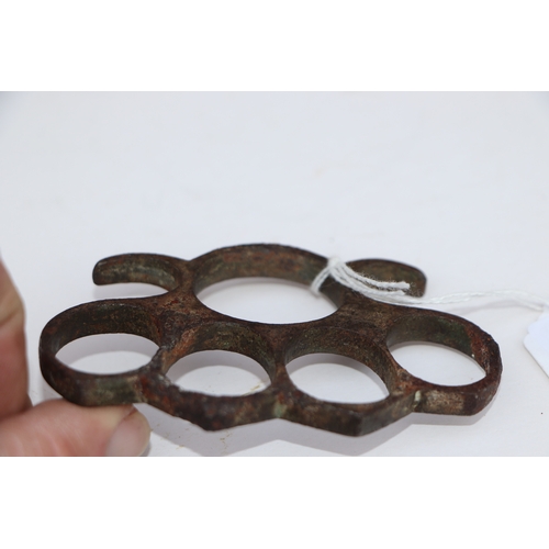 67 - A steel knuckle duster, 10cms wide.