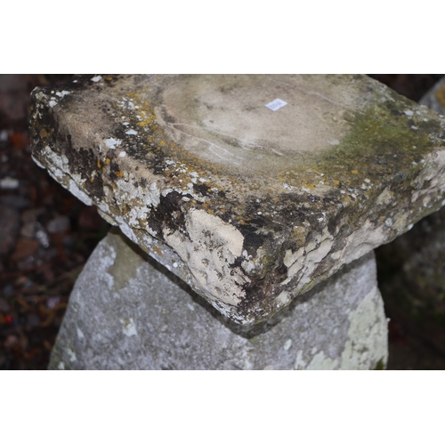 19 - A staddle stone with associated square top, 67cms high.