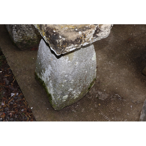 19 - A staddle stone with associated square top, 67cms high.